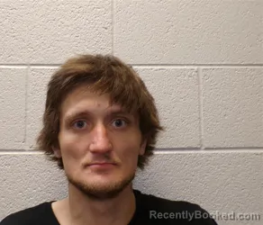 Mugshot of SLATER TRAVIS SIDES booked in Henderson County, North Carolina on April 1, 2026