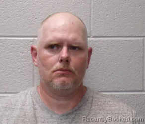 Mugshot of JONATHAN DON MINTZ booked in Henderson County, North Carolina on May 21, 2026
