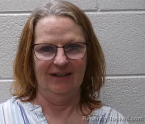 Mugshot of REBECCA MCCALL CREASMAN booked in Henderson County, North Carolina on April 24, 2026