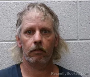 Mugshot of DOUGLAS CHARLES LAMBERT booked in Henderson County, North Carolina on June 24, 2026
