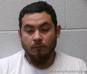 Mugshot of Oscar Baza booked in Henderson County, North Carolina on August 16, 2026