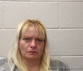 Mugshot of KELLY SUZANNE PARRIS booked in Henderson County, North Carolina on March 27, 2026