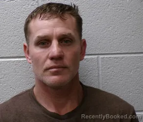 Mugshot of KENNETH KONRAD SCHLAGMULLER booked in Henderson County, North Carolina on April 1, 2026