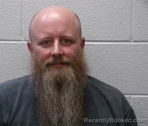 Mugshot of AUSTIN LEE JOHNSON booked in Henderson County, North Carolina on March 27, 2026