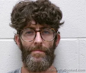 Mugshot of DUSTIN LEVI KINSEY booked in Henderson County, North Carolina on July 14, 2026