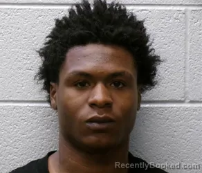 Mugshot of MALIK CARLDALE ANGRAM booked in Henderson County, North Carolina on June 25, 2026
