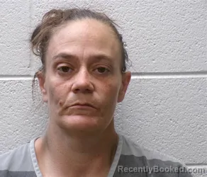 Mugshot of REBECCA NICOLE BADGER booked in Henderson County, North Carolina on May 21, 2026