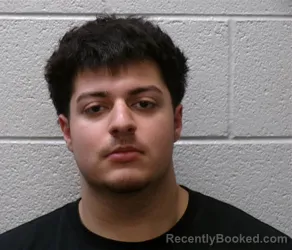 Mugshot of AIZED THOMAS AKBAR