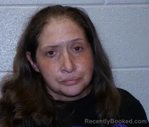 Mugshot of KETURA AMBER CAPPS booked in Henderson County, North Carolina on April 26, 2026