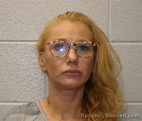 Mugshot of JENNIFER LEA SCANLON booked in Henderson County, North Carolina on April 30, 2026