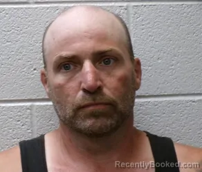Mugshot of JOSHUA WARNER KAMP booked in Henderson County, North Carolina on June 20, 2026