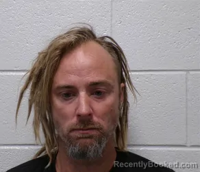 Mugshot of JEFFREY WARREN booked in Henderson County, North Carolina on July 14, 2026