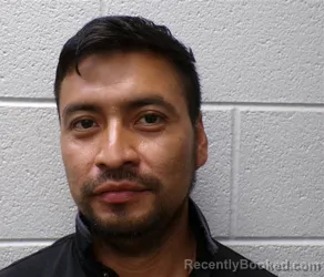 Mugshot of Isidro Miguel Bamaca booked in Henderson County, North Carolina on August 23, 2026