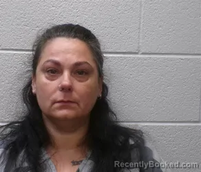 Mugshot of Angelique Eve Mills booked in Henderson County, North Carolina on August 30, 2026