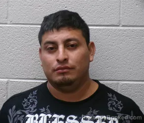 Mugshot of Bialio Angel Gonzalez Ramirez booked in Henderson County, North Carolina on October 4, 2026