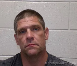Mugshot of DANIEL AARON PEACOCK booked in Henderson County, North Carolina on July 16, 2026