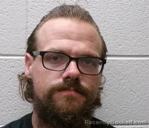 Mugshot of Joshua Shane Embler booked in Henderson County, North Carolina on September 5, 2026