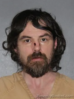 Mugshot of Travis Lee Denny