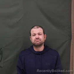 Mugshot of TRAVIS M NICOSON