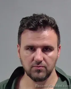 Mugshot of OLEG ALEKSANDROVICH MARTYNOV booked in Escambia County, Florida on March 8, 2026