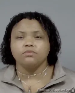 Mugshot of MARGO LAINE HOLSINGER booked in Escambia County, Florida on March 12, 2026