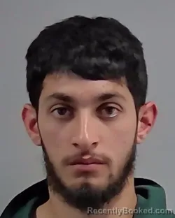 Mugshot of MIRWAIS NASERI booked in Escambia County, Florida on March 14, 2026