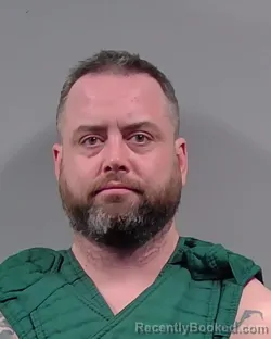 Mugshot of GARRET CHARLES HOLLAND booked in Escambia County, Florida on March 20, 2026