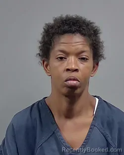 Mugshot of TOXSAY TENAY WARREN booked in Escambia County, Florida on March 27, 2026