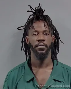 Mugshot of CLAUDATIOUS PERCELL LANE booked in Escambia County, Florida on March 27, 2026