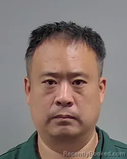 Mugshot of JIAKUN WANG booked in Escambia County, Florida on April 3, 2026