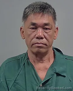 Mugshot of CHUNG VAN HUYNH booked in Escambia County, Florida on April 28, 2026