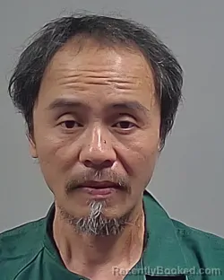 Mugshot of HUY MANH DUONG booked in Escambia County, Florida on April 28, 2026