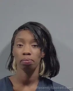 Mugshot of MENYETTE DENAE MOORE booked in Escambia County, Florida on May 2, 2026