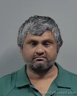 Mugshot of MAHENDRABHAI CHAUDHARI booked in Escambia County, Florida on May 8, 2026
