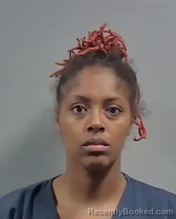 Mugshot of TATIJUANA KYNDIA WOODS booked in Escambia County, Florida on May 12, 2026