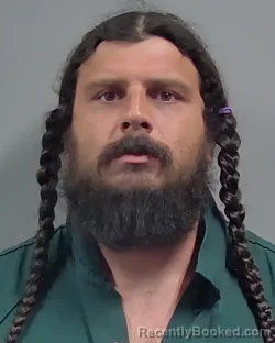 Mugshot of CAZMYN XAVIER DAVIDSON booked in Escambia County, Florida on May 18, 2026