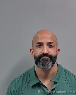 Mugshot of Shaji Varughese booked in Escambia County, Florida on August 20, 2026
