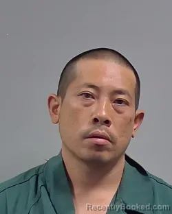 Mugshot of Truong Van Tran booked in Escambia County, Florida on August 21, 2026