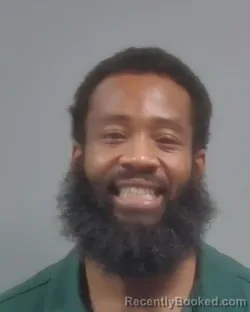 Mugshot of Michael Dominique Donson booked in Escambia County, Florida on October 7, 2026