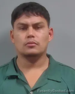 Mugshot of Melvin Ariel Guzman Cruz booked in Escambia County, Florida on October 8, 2026