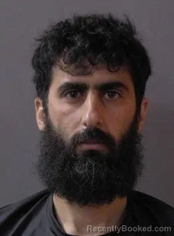Mugshot of Faris Mahamad Hassan Altahat booked in Hamilton County, Indiana on July 14, 2026