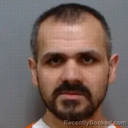 Mugshot of KAMAL NMI BOLA booked in Hendricks County, Indiana on April 29, 2026