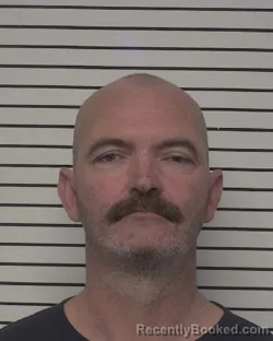 Mugshot of CHARLES LEE MOORE booked in Iredell County, North Carolina on March 14, 2026