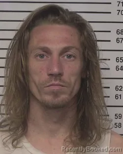 Mugshot of SPENCER EDWARD LYNAM SCHWAB booked in Iredell County, North Carolina on April 1, 2026