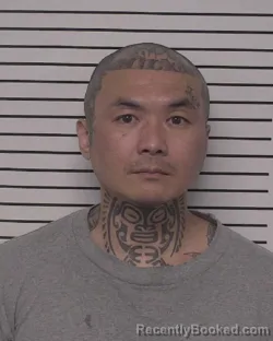 Mugshot of JOHN CHASENGNOU booked in Iredell County, North Carolina on March 27, 2026