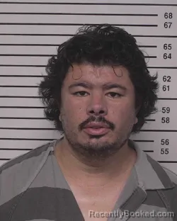 Mugshot of ANDREW CHRISTOPHER TAM booked in Iredell County, North Carolina on July 2, 2026