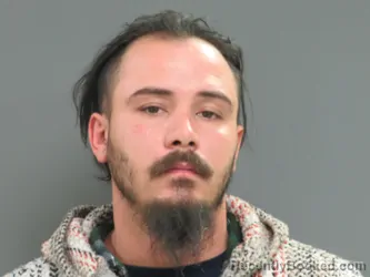 Mugshot of JOHNATHAN D HARVEY