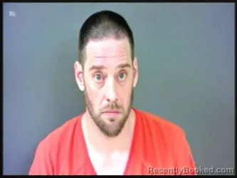 Mugshot of JOSHUA I WOOLUM