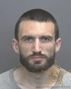 Mugshot of TYLER MATTHEW EMRICH