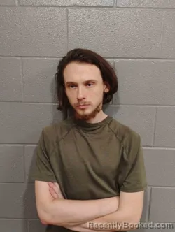 Mugshot of AUSTIN HUFFMAN